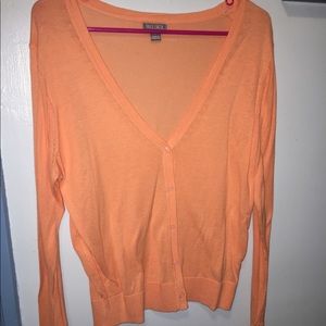 Peachy colored cardigan